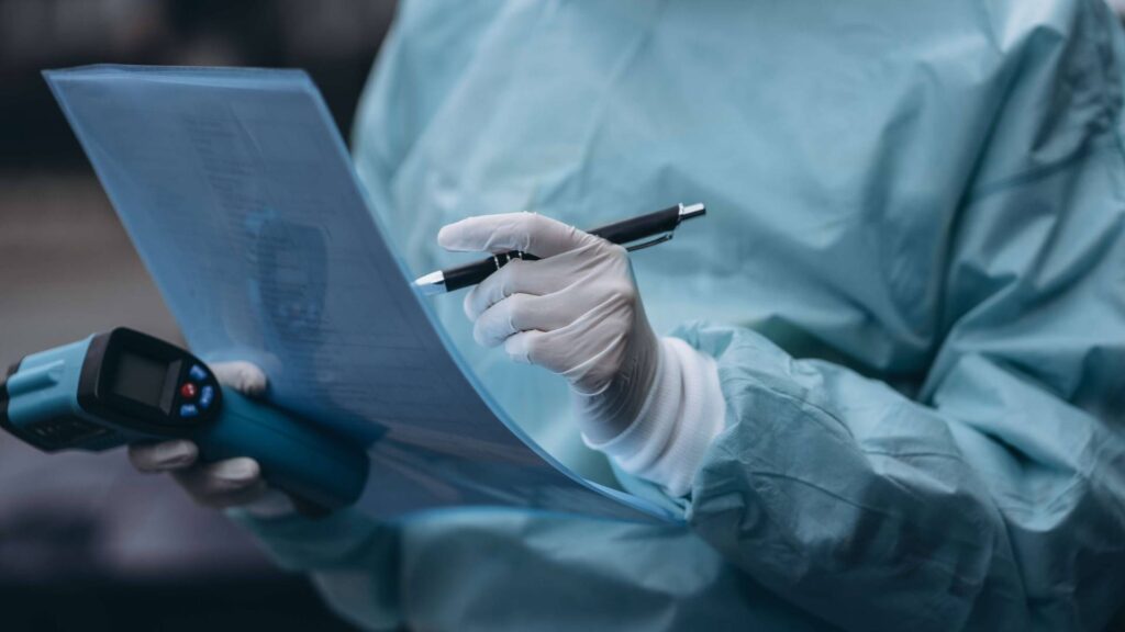 Nurse filling out COVID-19 forms